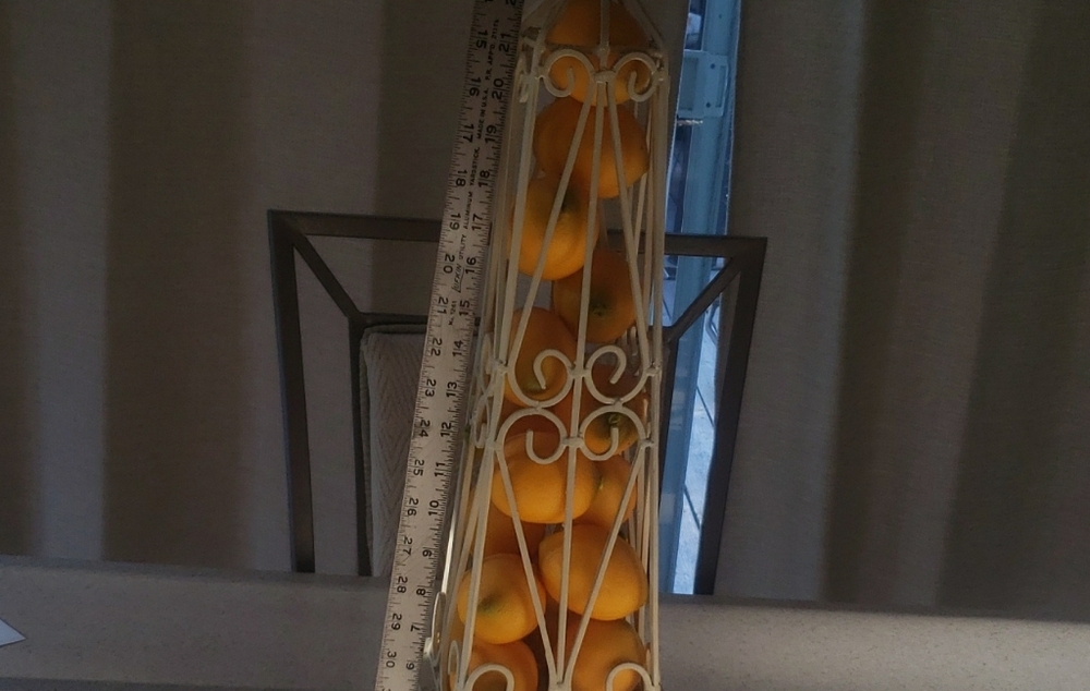 Decorative White Metal Obelisk with Orange Accents
